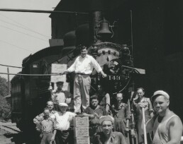 Fauerbach Brewery team standing in front of a steam locomotive in Madison, WI.